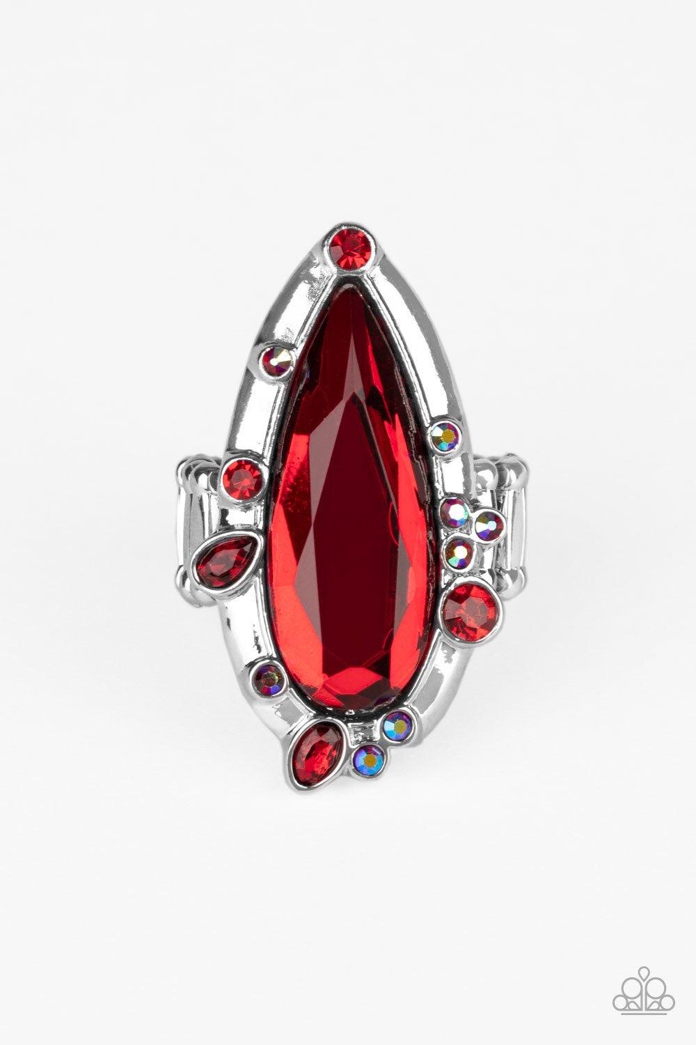Paparazzi Accessories Sparkle Smitten - Red Varying in color and shape, mismatched red iridescent rhinestones sporadically dot the front of a shiny silver teardrop frame. Featuring a flashy faceted surface, an oversized red teardrop gem adorns the center