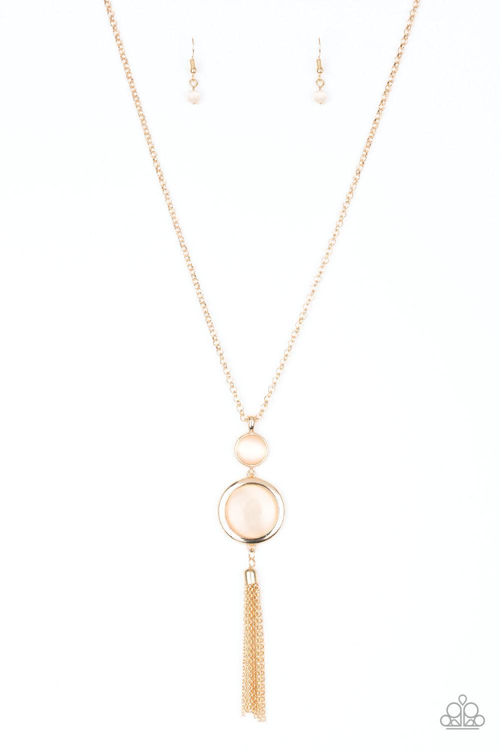 Paparazzi Accessories Have Some Common SENSEI - Gold Swinging from the bottom of a glistening gold chain, glowing stacked moonstone pendants give way to a shimmery gold tassel for a refined look. Features an adjustable clasp closure. Sold as one individua