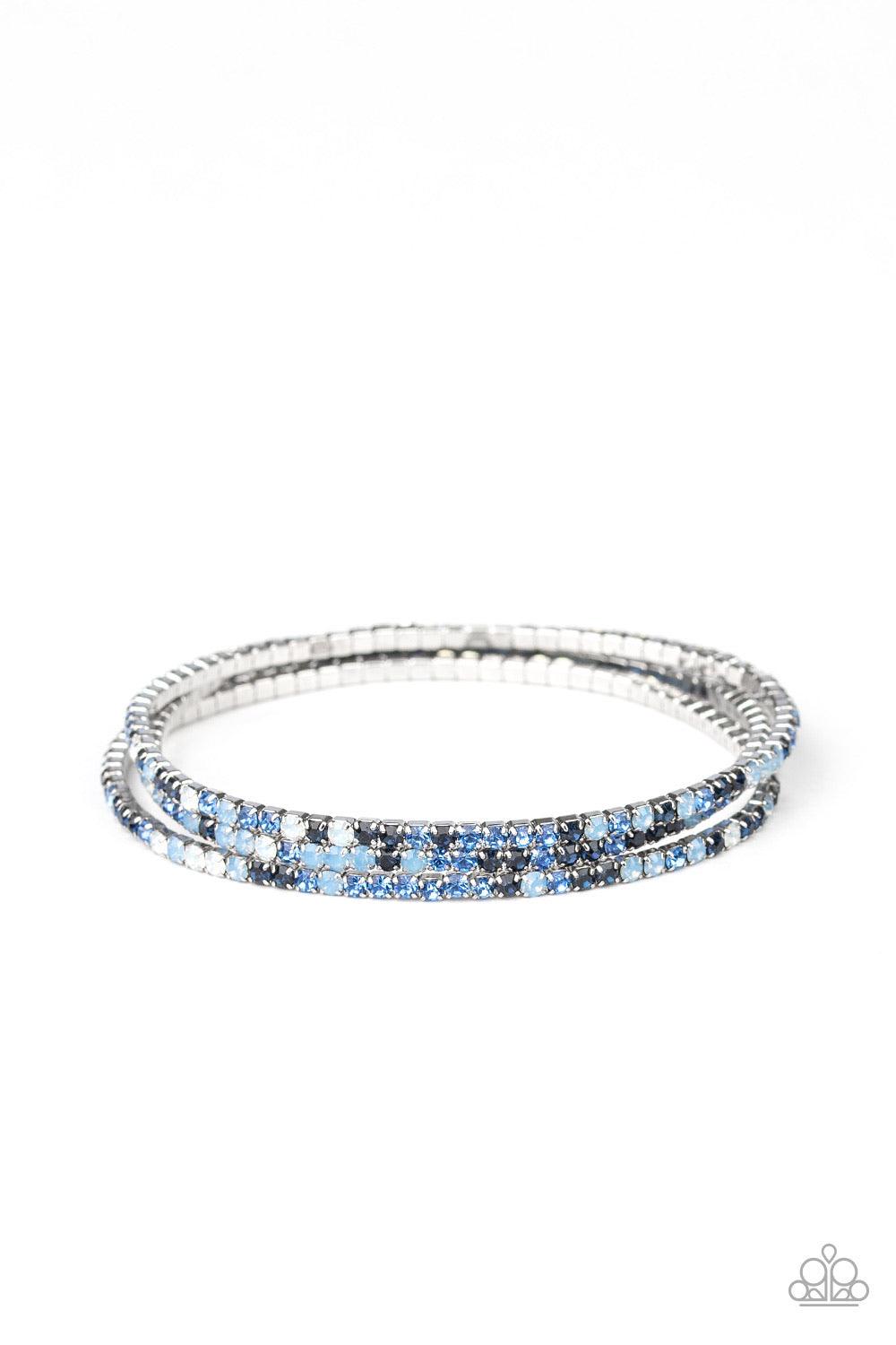 Paparazzi Accessories Sugar And ICE - Blue Featuring classic and opalescent finishes, a collection of dainty blue and white rhinestones are threaded along stretchy bands, creating glittery layers across the wrist. Jewelry