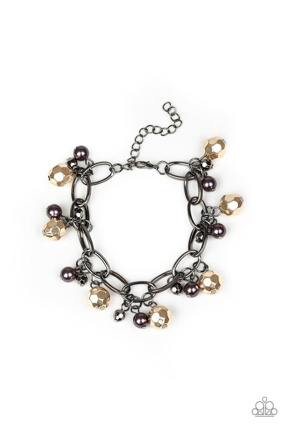 Paparazzi Accessories Make in Malibu - Multi Varying in size, a collection of faceted gold and pearly gunmetal beads swings from a bold gunmetal chain, creating a whimsical metallic fringe around the wrist. Features an adjustable clasp closure. Sold as on