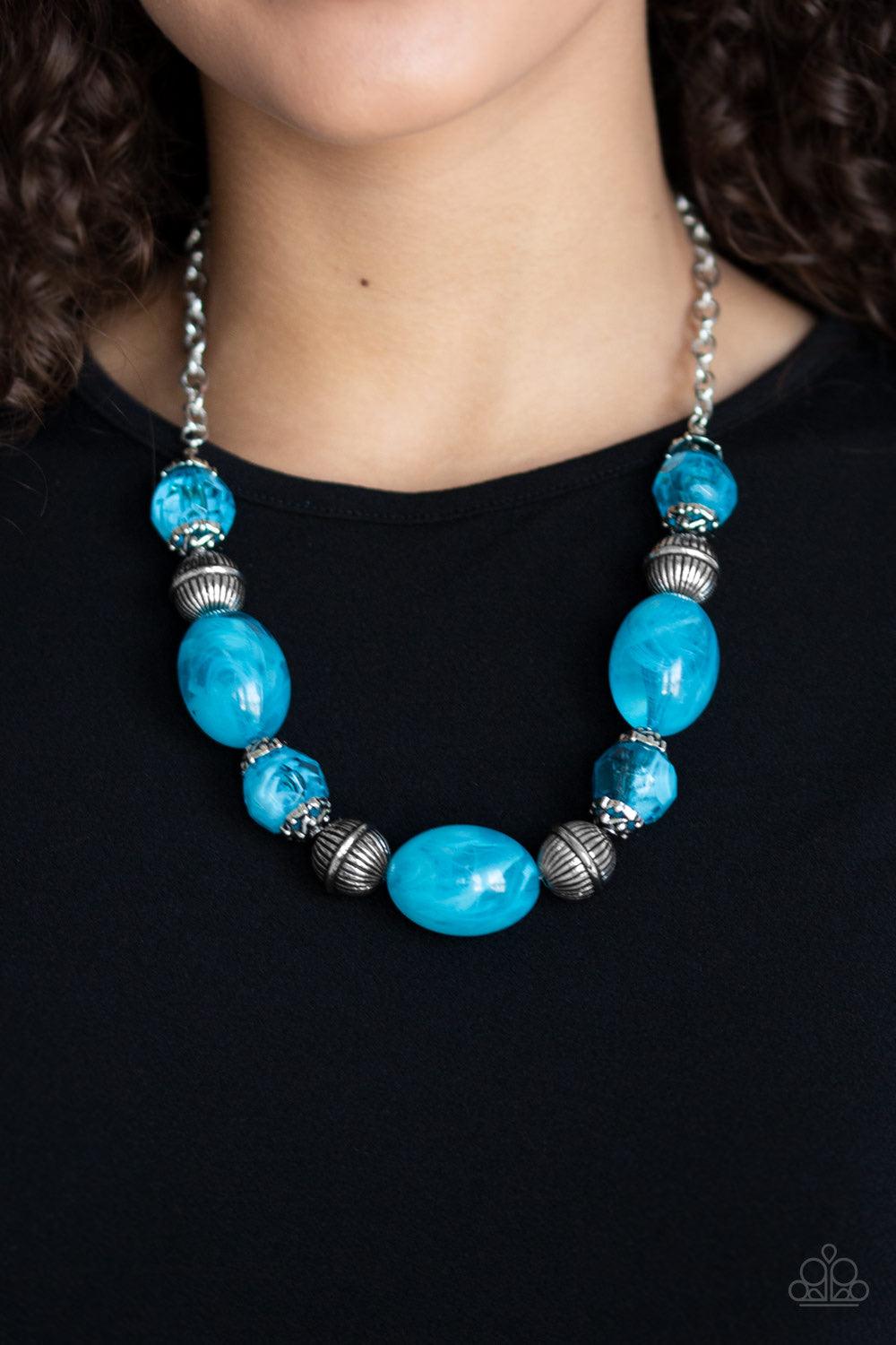 Paparazzi Accessories Ice Melt - Blue Featuring an array of antiqued silver beads, an icy collection of oversized glassy blue beads are threaded along an invisible wire below the collar for a colorful, statement making look. Features an adjustable clasp c