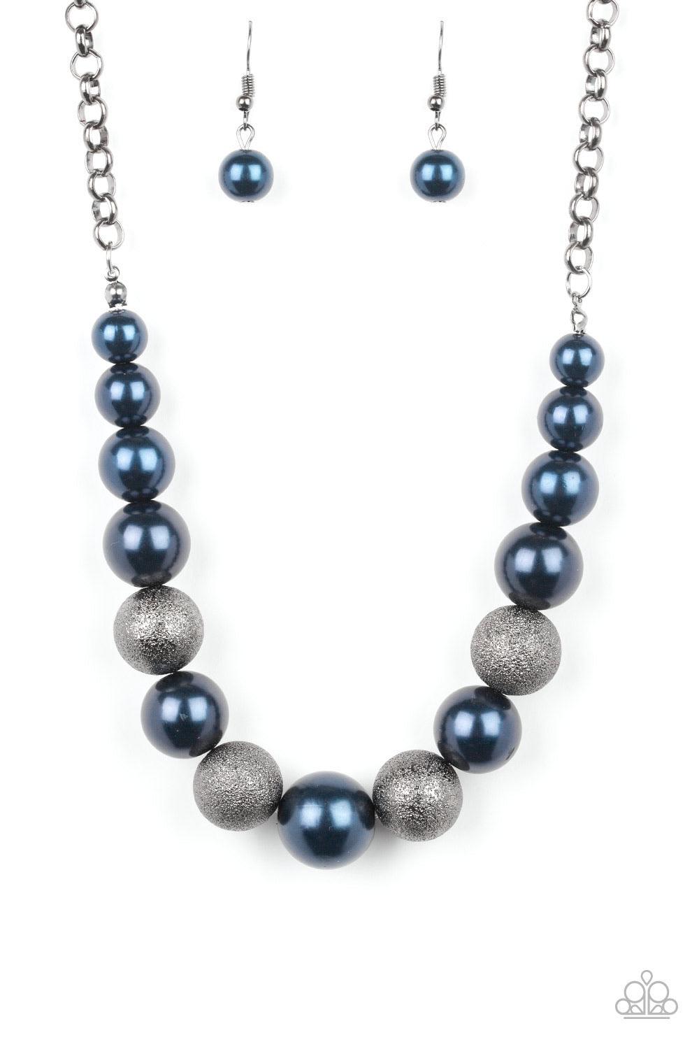 Paparazzi Accessories Color Me CEO - Blue Dusted in glitter, sparkling gunmetal and pearly blue beads are threaded along an invisible wire below the collar for a glamorous look. Features an adjustable clasp closure. Sold as one individual necklace. Includ