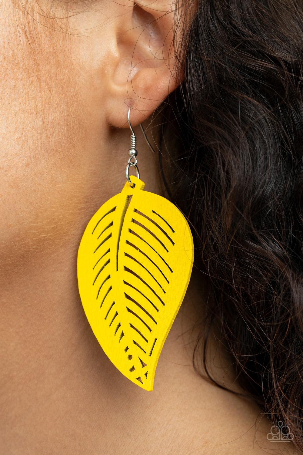 Paparazzi Accessories Tropical Foliage ~Yellow Painted in a sunny yellow finish, a wooden frame is delicately cut into an airy leaf pattern for a seasonal flair. Earring attaches to a standard fishhook fitting. Sold as one pair of earrings.