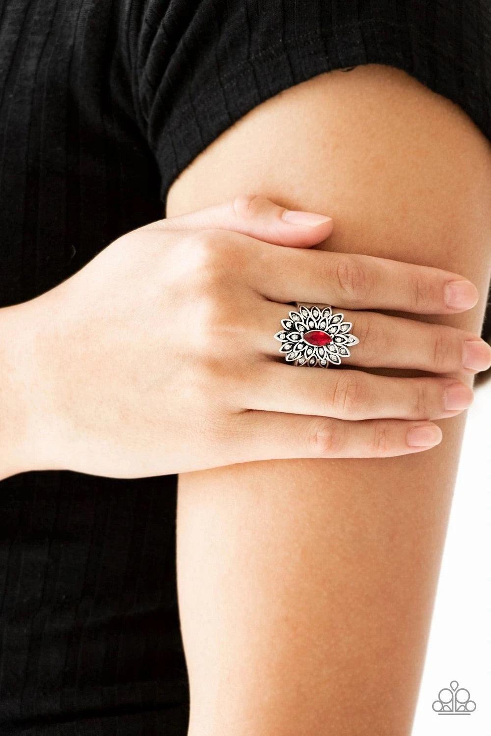 Paparazzi Accessories Blooming Fireworks - Red Dotted in dainty white rhinestones, silver petals radiate from a regal red marquise shaped rhinestone center for an edgy look. Features a stretchy band for a flexible fit. Sold as one individual ring. Jewelry
