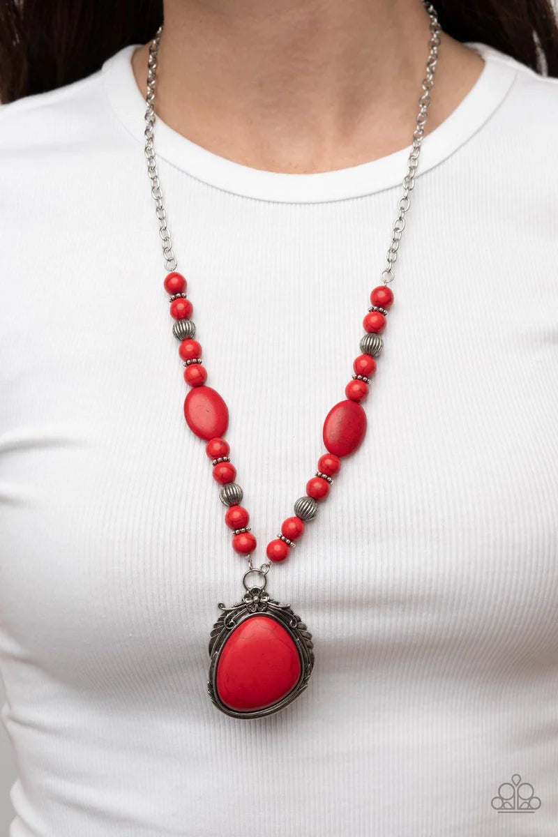 Paparazzi Accessories Southwest Paradise - Red A lengthened silver chain flows into a succession of polished red stone beads and silver accents. The flowy display gives way to an opulent red stone that is pressed into an ornate silver frame. Adorned with