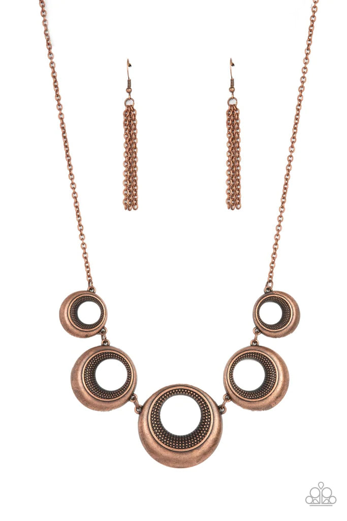 Paparazzi Accessories Solar Cycle - Copper Featuring studded centers, an antiqued collection of beveled copper hoops gradually increase in size as they link below the collar for a bold metallic look. Features an adjustable clasp closure. Sold as one indiv