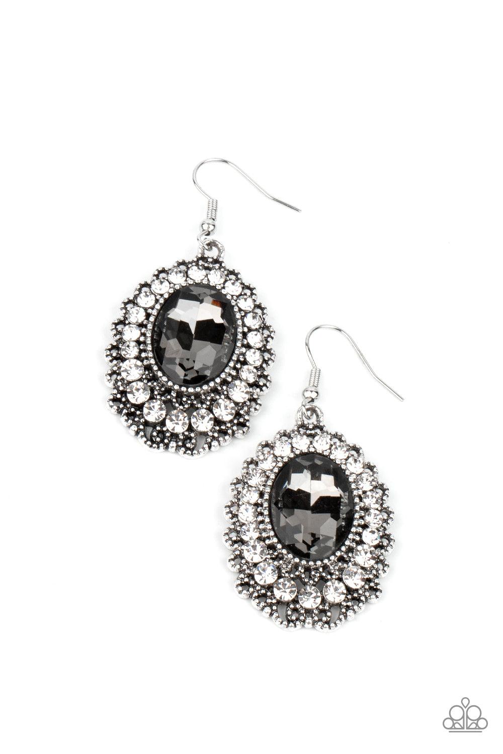 Paparazzi Accessories Glacial Gardens - Silver A smoky gem is pressed into the center of an ornately studded frame bordered in glassy white rhinestones, creating a glamorous statement piece. Earring attaches to a standard fishhook fitting. Sold as one pai