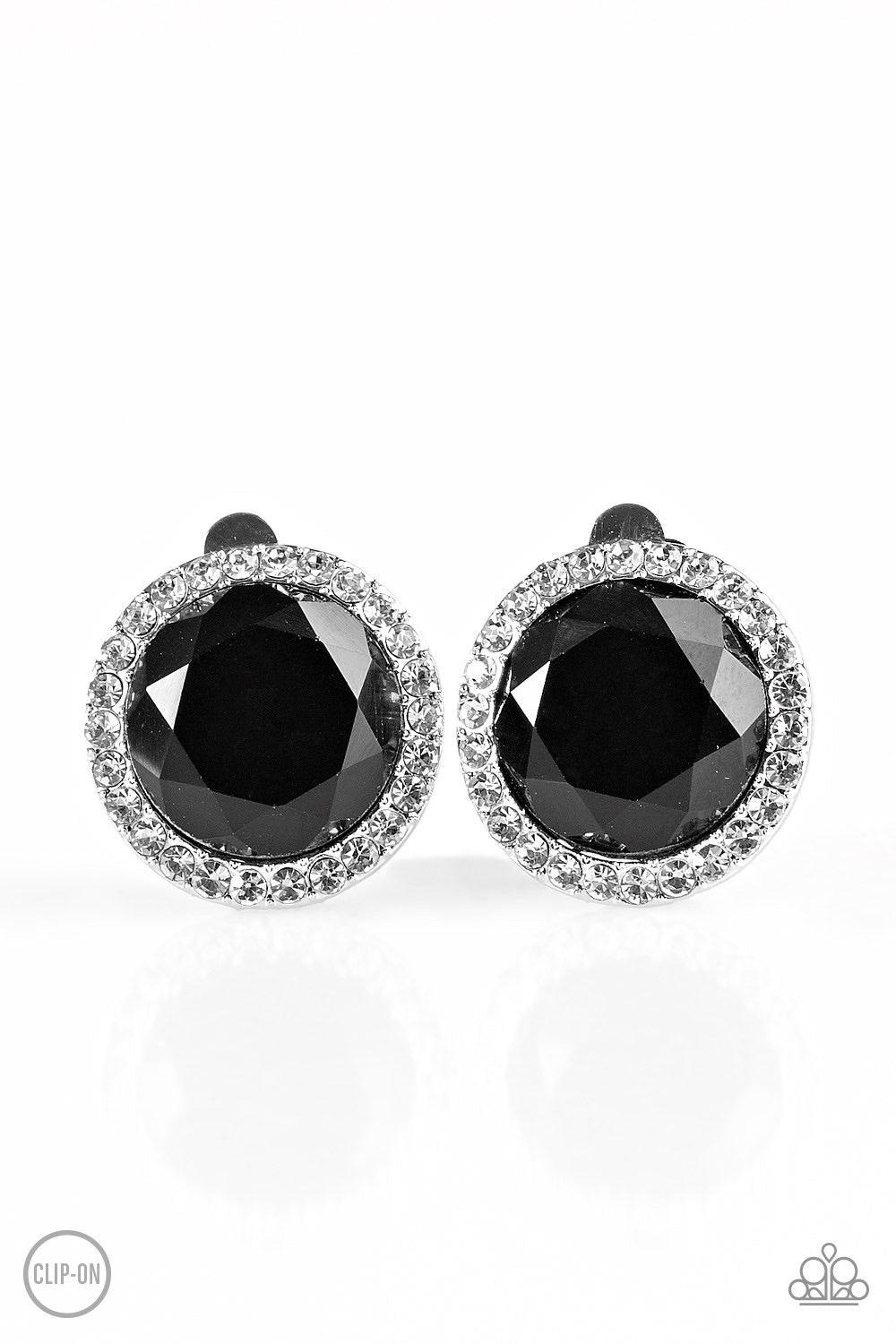 Paparazzi Accessories Positively Princess ~Black *Clip-On A glassy black gem is pressed into the center of a white rhinestone encrusted frame for a timeless look. Earring attaches to a standard clip-on fitting.