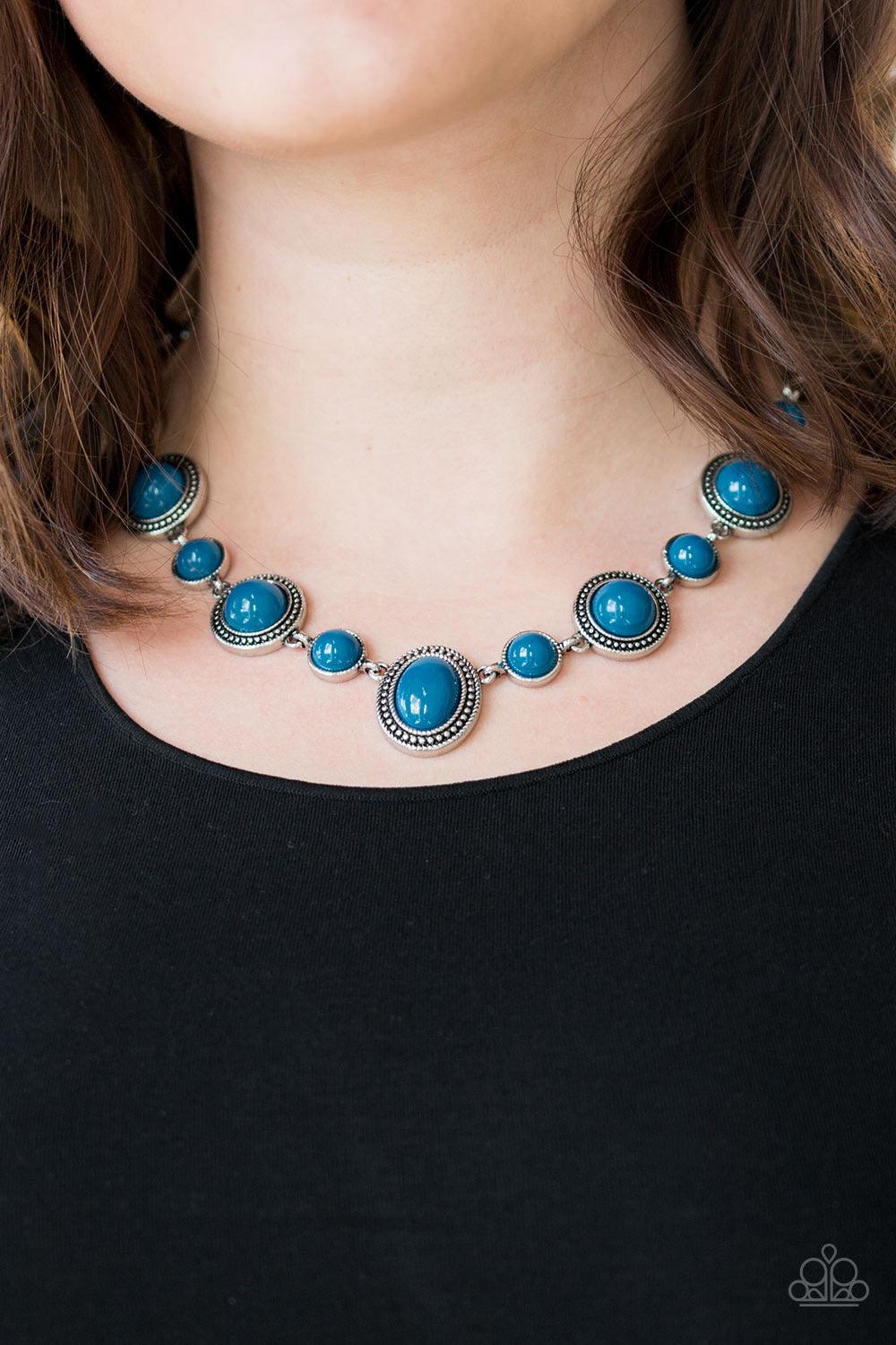 Paparazzi Accessories Voyager Vibes ~Blue Featuring smooth and studded silver frames, refreshing blue beads link below the collar in a seasonal fashion. Features an adjustable clasp closure. Sold as one individual necklace. Includes one pair of matching e