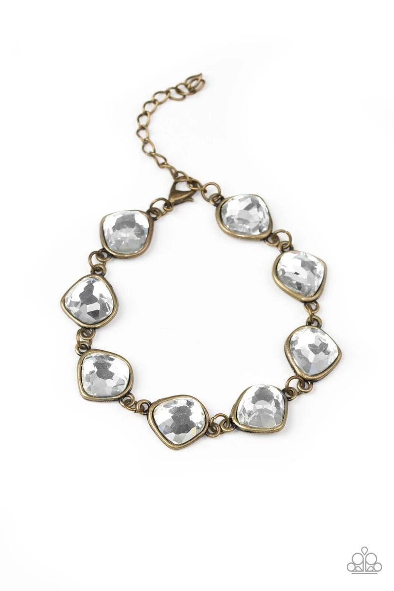 Paparazzi Accessories Perfect Imperfection - Brass Featuring antiqued brass frames, imperfect glassy white gems link around the wrist for a glamorous vintage inspired look. Features an adjustable clasp closure. Sold as one individual bracelet. Jewelry