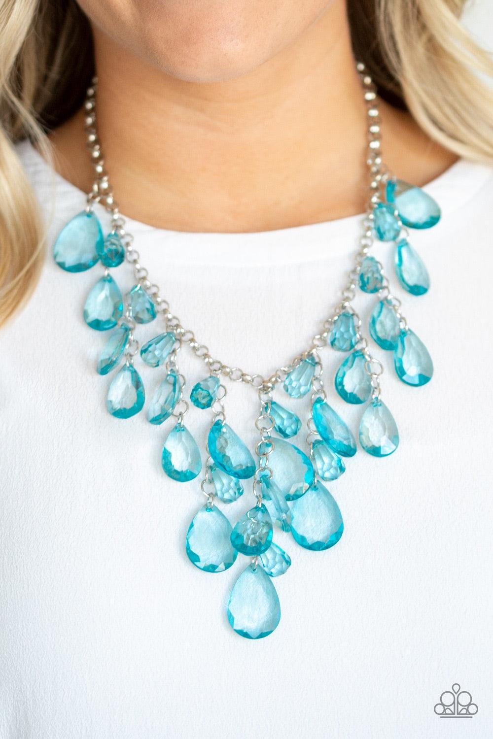 Paparazzi Accessories Irresistible Iridescence - Blue Glassy blue teardrop beads swing from the bottom of a shimmery silver chain. Matching beads trickle down free-falling chains, creating a glamorous fringe below the collar. Features an adjustable clasp