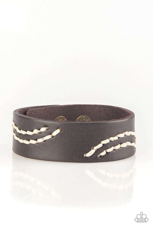 Paparazzi Accessories Rural Roamer - Brown Sections of white cording is stitched across the front of a brown leather band for a whimsical look. Features an adjustable snap closure. Jewelry