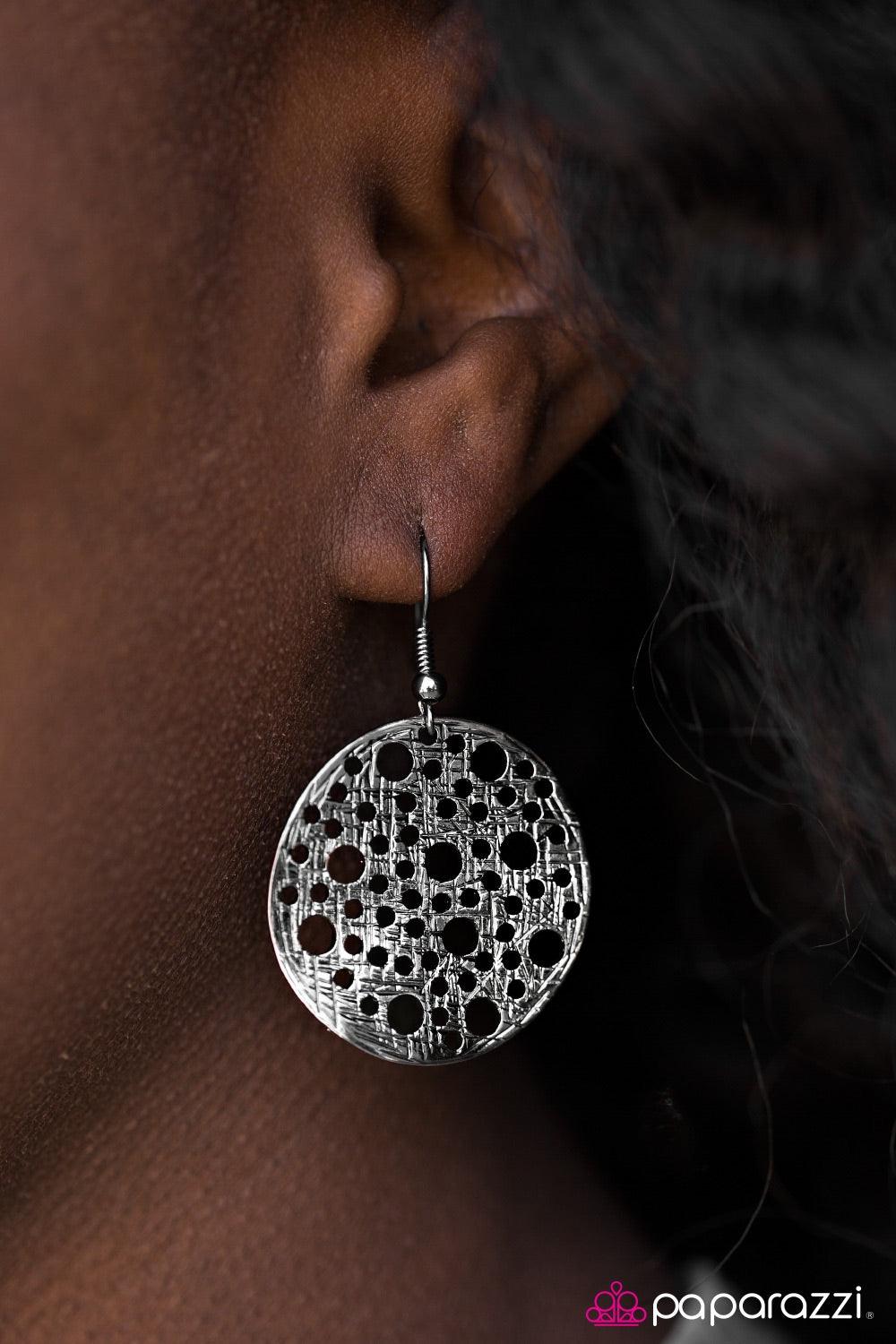 Paparazzi Accessories The HOLE Wide World - Black Brushed in a shiny shimmer, a delicately hammered gunmetal disc swings from the ear. Etched in tactile textures, the gunmetal frame is accented with round holes for an airy finish. Earring attaches to a st