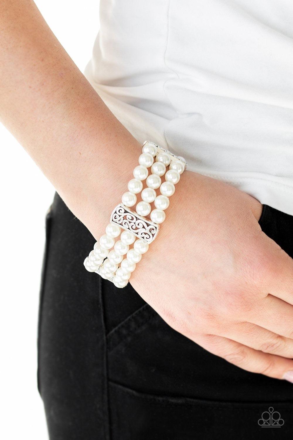 Paparazzi Accessories Ritzy Ritz - White Infused with ornate silver frames, row after row of white pearls are threaded along stretchy bands around the wrist for a refined flair. Jewelry