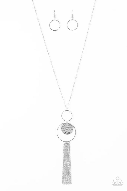 Paparazzi Accessories Faith Makes All Things Possible - Silver A delicately hammered silver disc is stamped in the inspirational word, "faith" and suspended from a double-hooped pendant at the bottom of an elongated silver satellite chain. A silver tassel