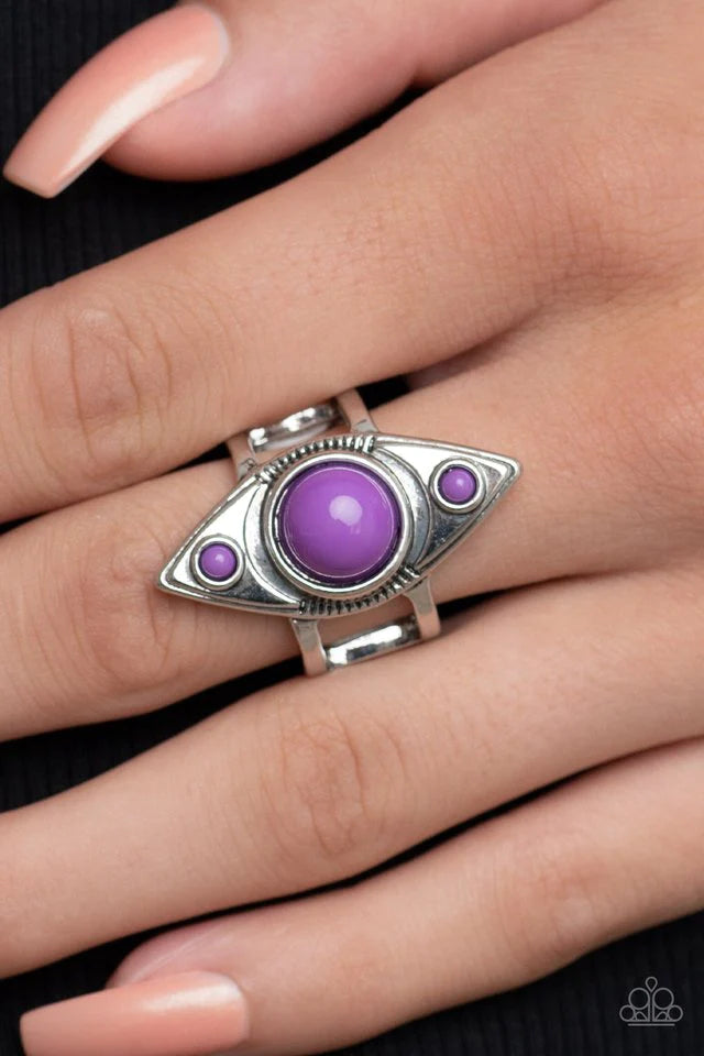 Paparazzi Accessories Pivoting Point - Purple Three bubbly purple beads stack across the front of a textured silver oblong frame, resulting in a playful pop of color atop layered silver bands. Features a stretchy band for a flexible fit. Jewelry