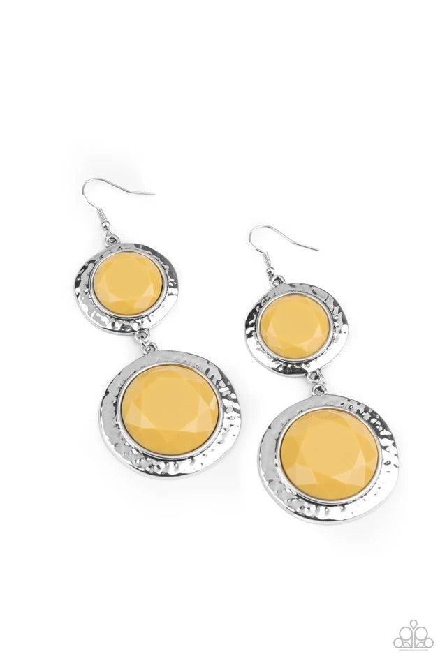 Paparazzi Accessories Thrift Shop Stop - Yellow Varying in size, a pair of faceted yellow beads are pressed into the shimmery centers of hammered silver frames as they link into a colorfully rustic lure. Earring attaches to a standard fishhook fitting. So