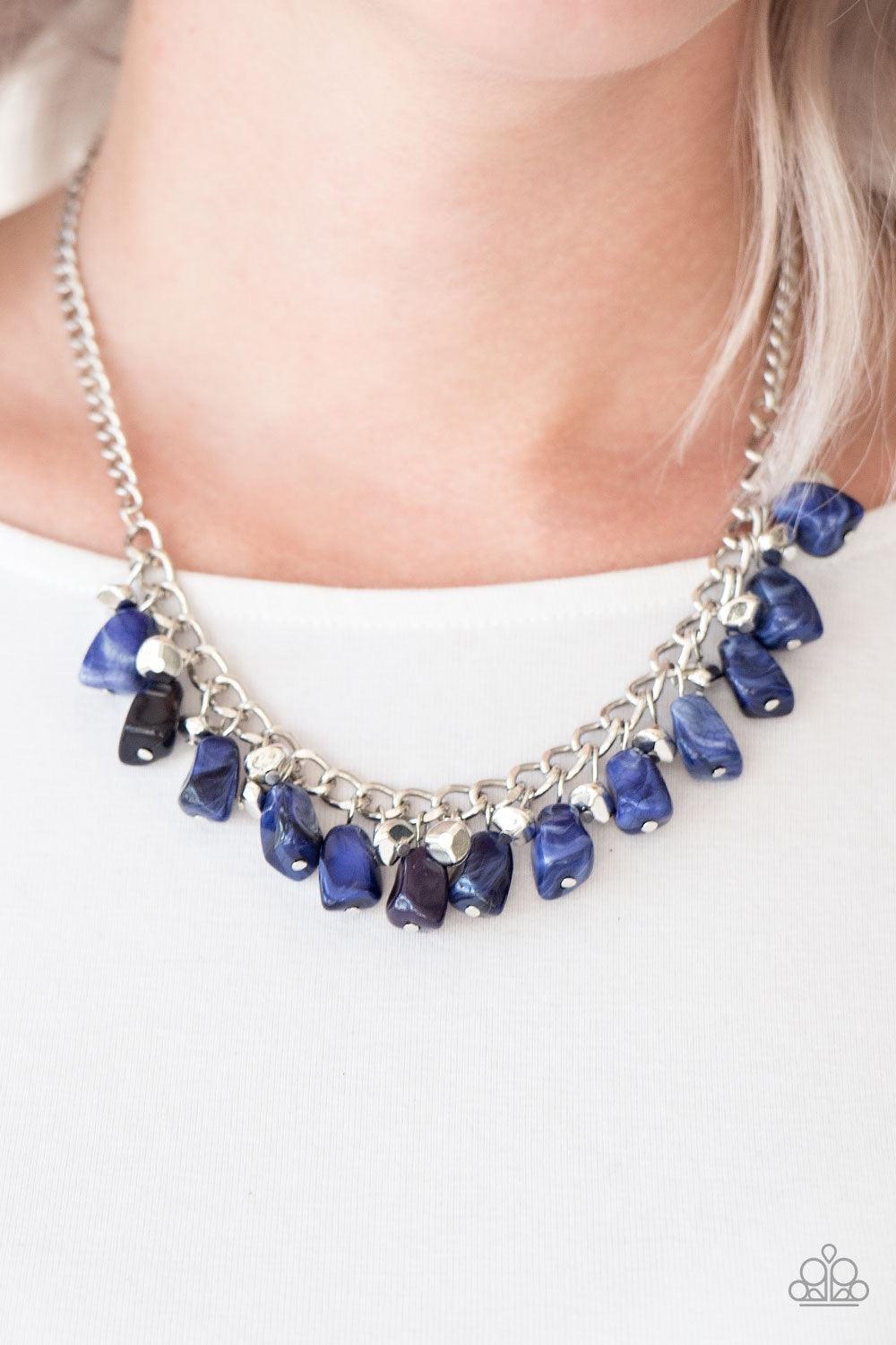 Paparazzi Accessories Rocky Shores ~Blue Faceted silver and blue faux-rock beading trickle from the bottom of a bold silver chain, creating a colorful fringe below the collar. Features an adjustable clasp closure.