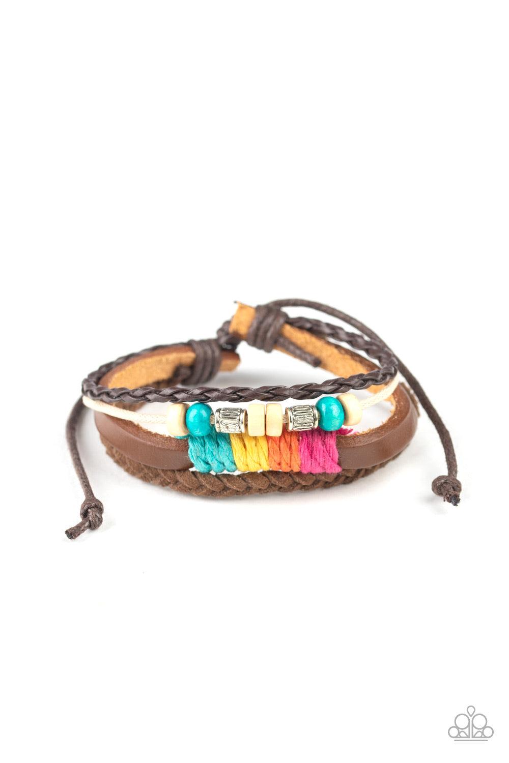 Paparazzi Accessories Rogue Rainbow - Multi Infused with wooden, silver, and rainbow threaded accents, mismatched leather and twine bands layer around the wrist for a colorful look. Features an adjustable sliding knot closure. Jewelry
