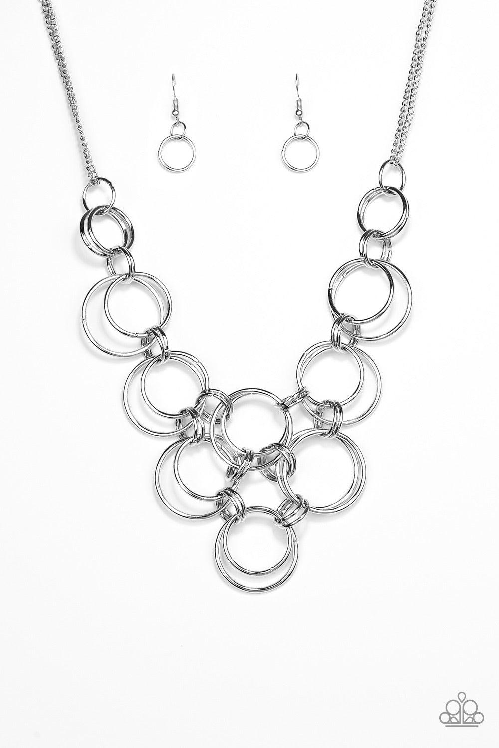 Paparazzi Accessories Ringing Off The Hook - Silver Brushed in a glistening shimmer, silver rings link together below the collar, creating a bold interlocking pendant. Features an adjustable clasp closure. Sold as one individual necklace. Includes one pai