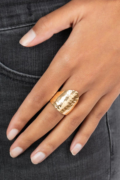 Paparazzi Accessories Basic Instincts - Gold Mirrored, reflective gold metal forms a thick cone, creating a solid statement piece perfect for any wardrobe. Features a stretchy band for a flexible fit. Sold as one individual Paparazzi ring. Jewelry