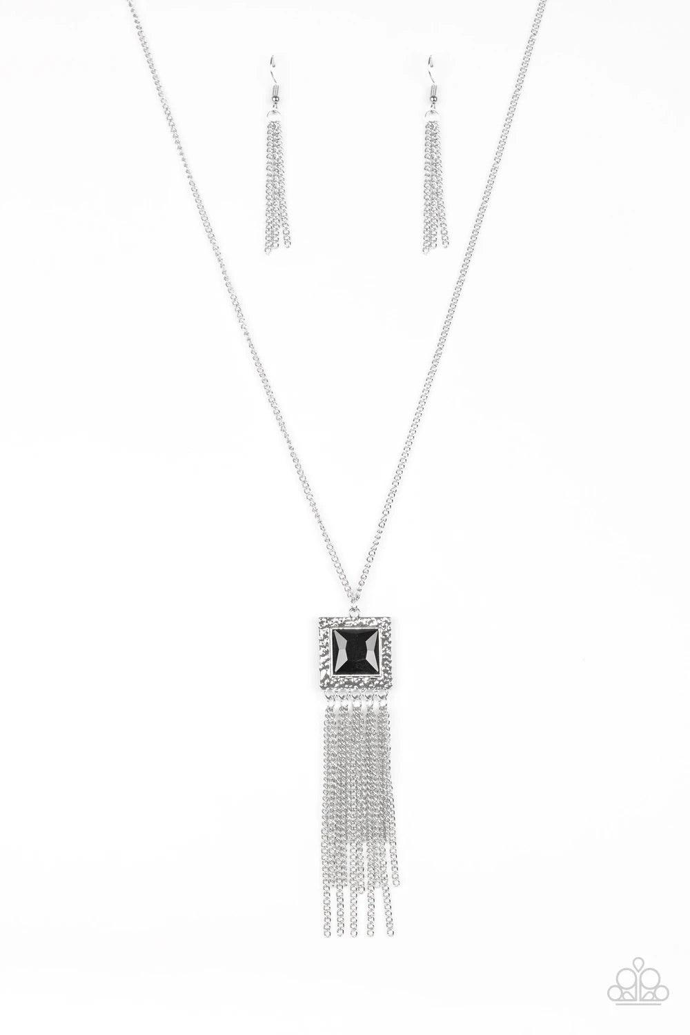 Paparazzi Accessories Shimmer Sensei - Black Swinging from the bottom of a lengthened silver chain, a delicately hammered square frame gives way to a shimmery silver fringe. Featuring a regal square cut, a glittery black gem is pressed into the center of
