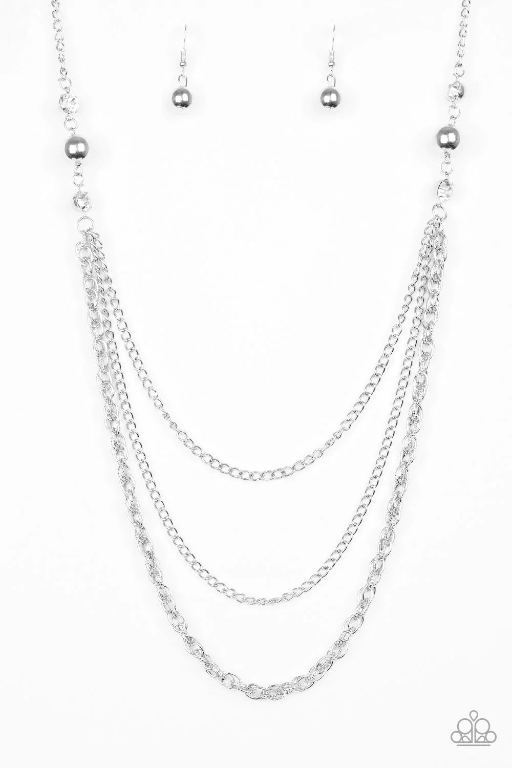 Paparazzi Accessories RITZ it All - White Glittery white rhinestones and oversized silver beads give way to layers of mismatched silver chains for a refined look. Features an adjustable clasp closure. Sold as one individual necklace. Includes one pair of