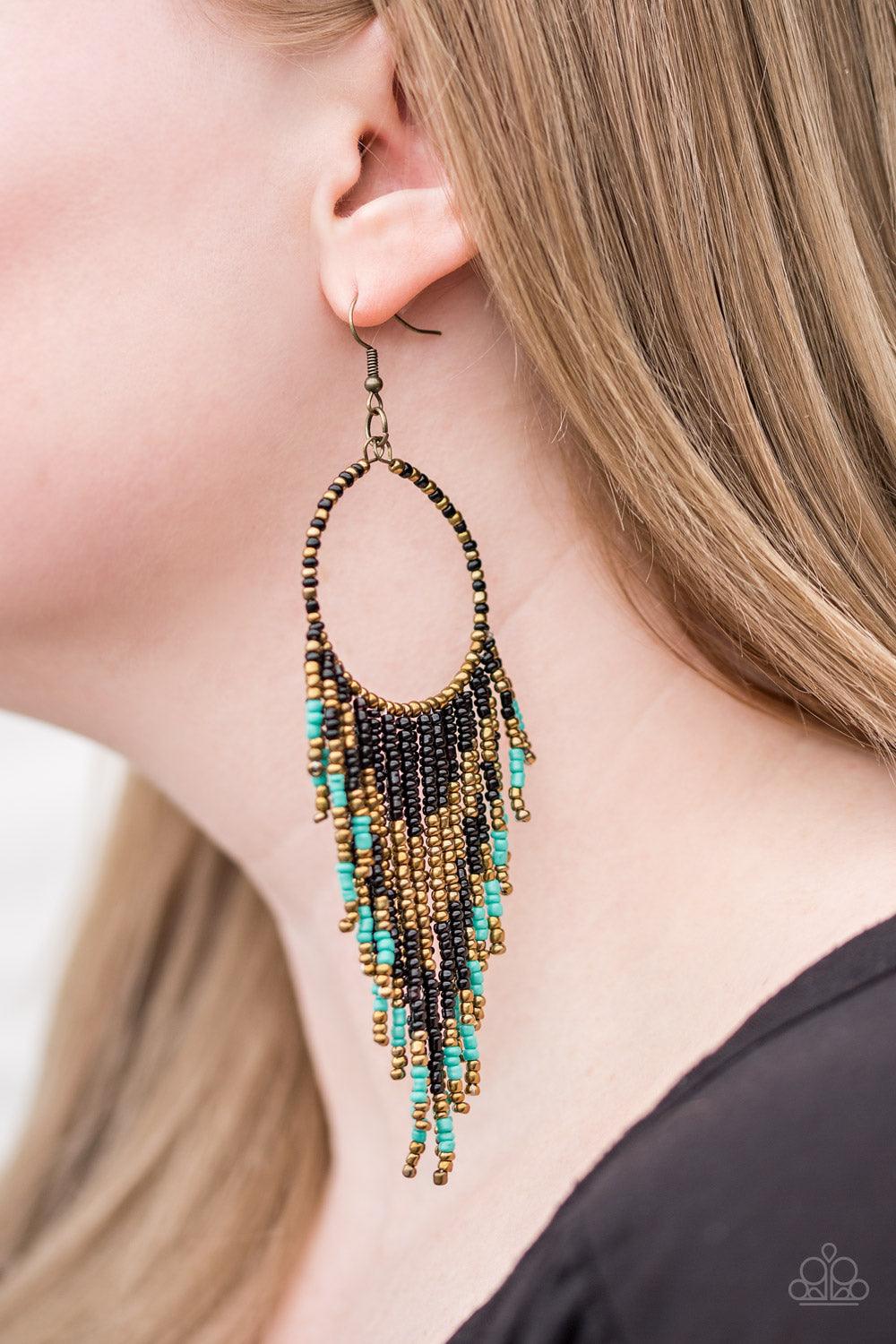 Paparazzi Accessories Live Off The BADLANDS - Black Infused with black, brass, and turquoise seed beads, a colorful dream catcher frame swings from the ear for a seasonal look. Earring attaches to a standard fishhook fitting. Sold as one pair of earrings.
