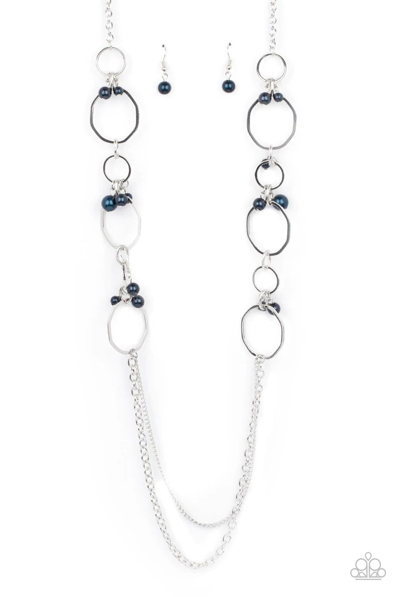 Paparazzi Accessories Ante UPSCALE - Blue Oversized bent silver hoops accented with Montana Blue pearl charms link together for a refined upscale design. A set of mismatched chains at the end of the lengthened necklace adds balance. Features an adjustable