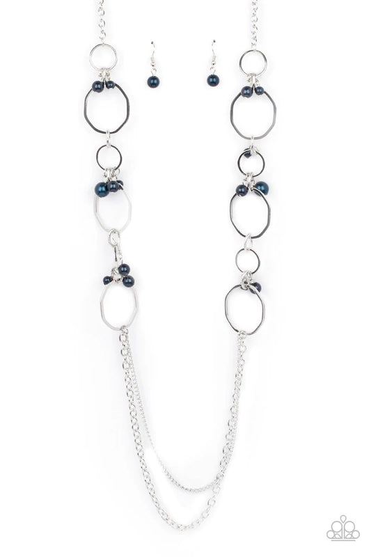 Paparazzi Accessories Ante UPSCALE - Blue Oversized bent silver hoops accented with Montana Blue pearl charms link together for a refined upscale design. A set of mismatched chains at the end of the lengthened necklace adds balance. Features an adjustable
