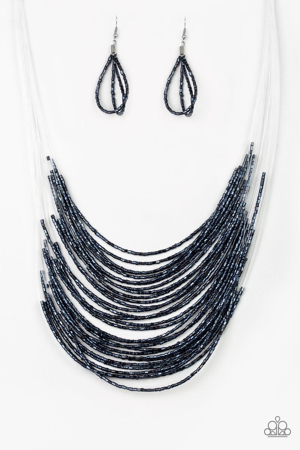 Paparazzi Accessories Catwalk Queen - Blue Strand after strand of metallic blue seed beads fall together to create a bold statement piece. Features an adjustable clasp closure. Jewelry