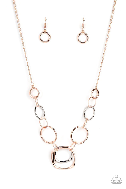 Paparazzi Accessories Linked Up Luminosity - Multi A mismatched collection of rose gold rings and asymmetrical silver hoops delicately links below the collar, resulting in a modern industrial display. Features an adjustable clasp closure. Sold as one indi