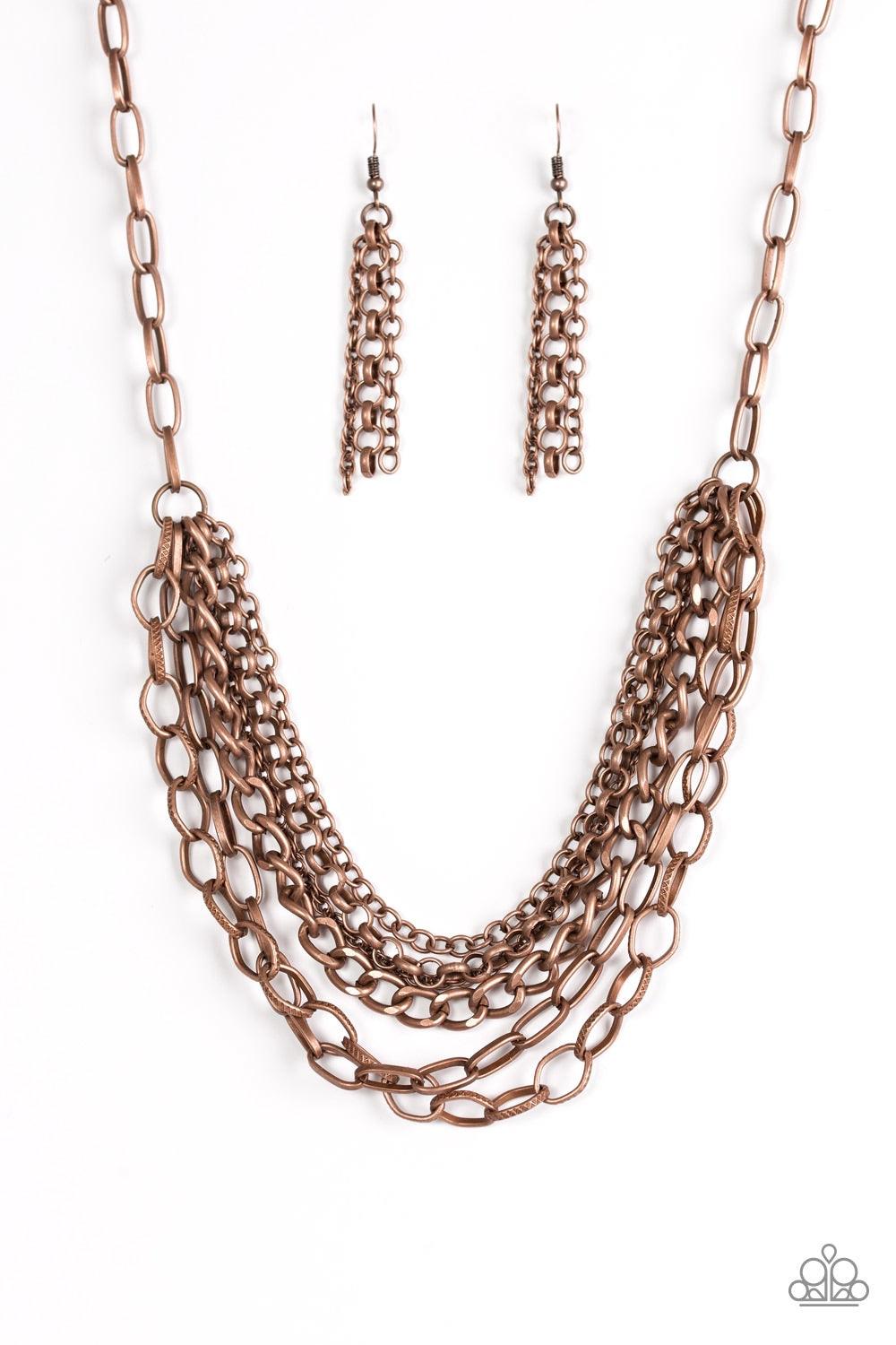Paparazzi Accessories Word on the Street - Copper Varying in size and shape, glistening copper chains layer below the collar. Featuring smooth and textured links, the mixed metallic palette stacks into a collision of industrial shimmer for an edgy look. F