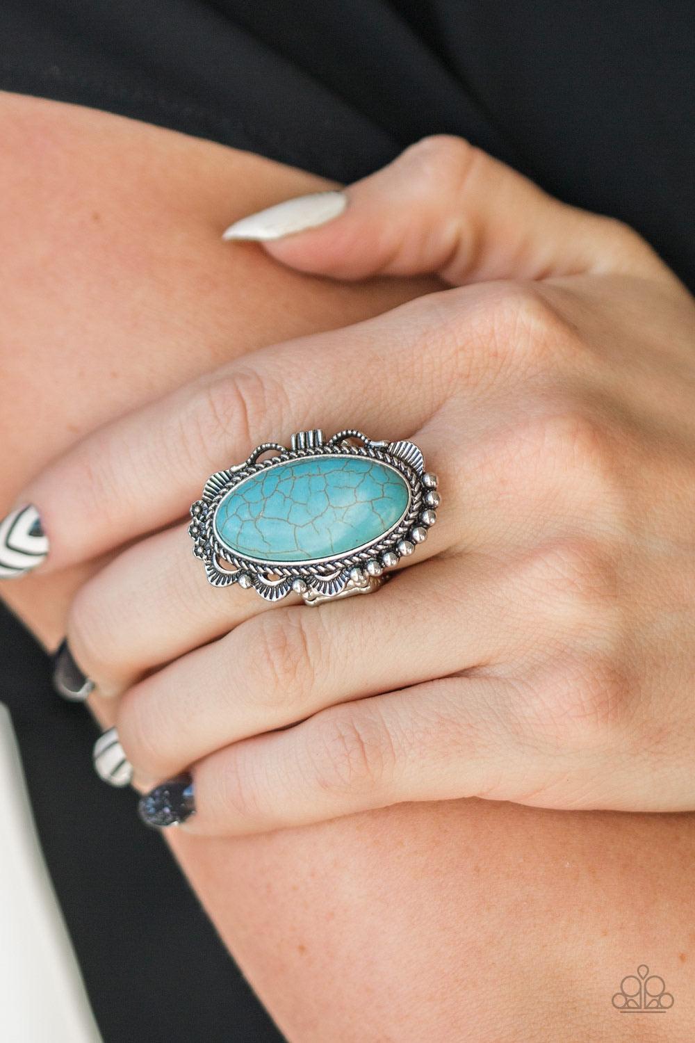 Paparazzi Accessories Open Range - Blue A refreshing turquoise stone is pressed into an ornate silver frame rippling with studded and serrated textures for a seasonal flair. Features a stretchy band for a flexible fit. Sold as one individual ring. Jewelry