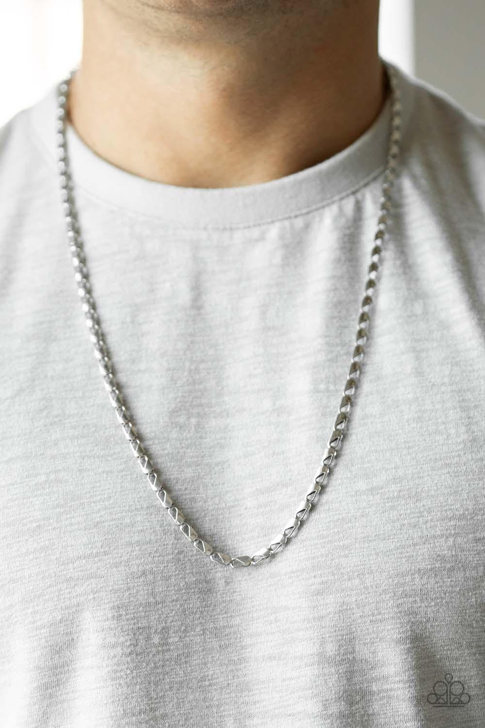 Paparazzi Accessories Free Agency - Silver Featuring clasp-like links, an ornate silver chain drapes across the chest for a causal look. Features an adjustable clasp closure. Sold as one individual necklace. Jewelry