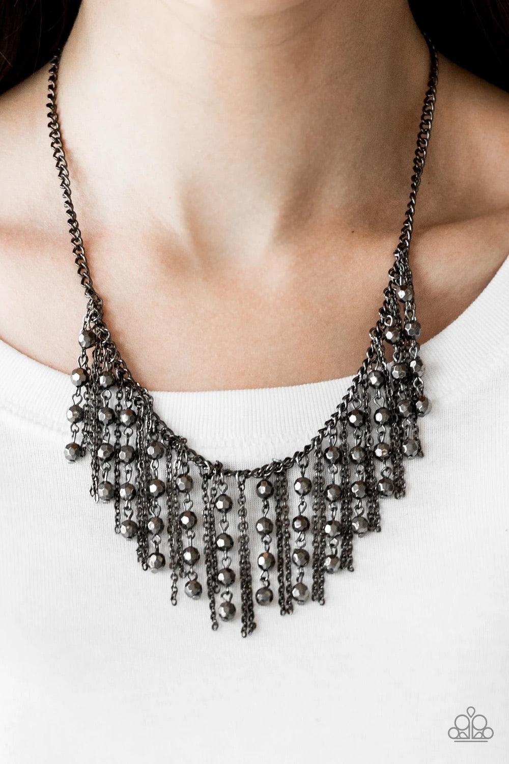 Paparazzi Accessories Rebel Remix - Black Strands of faceted gunmetal beads and glistening gunmetal chains stream from a matching gunmetal chain, creating an edgy fringe below the collar. Features an adjustable clasp closure. Sold as one individual neckla