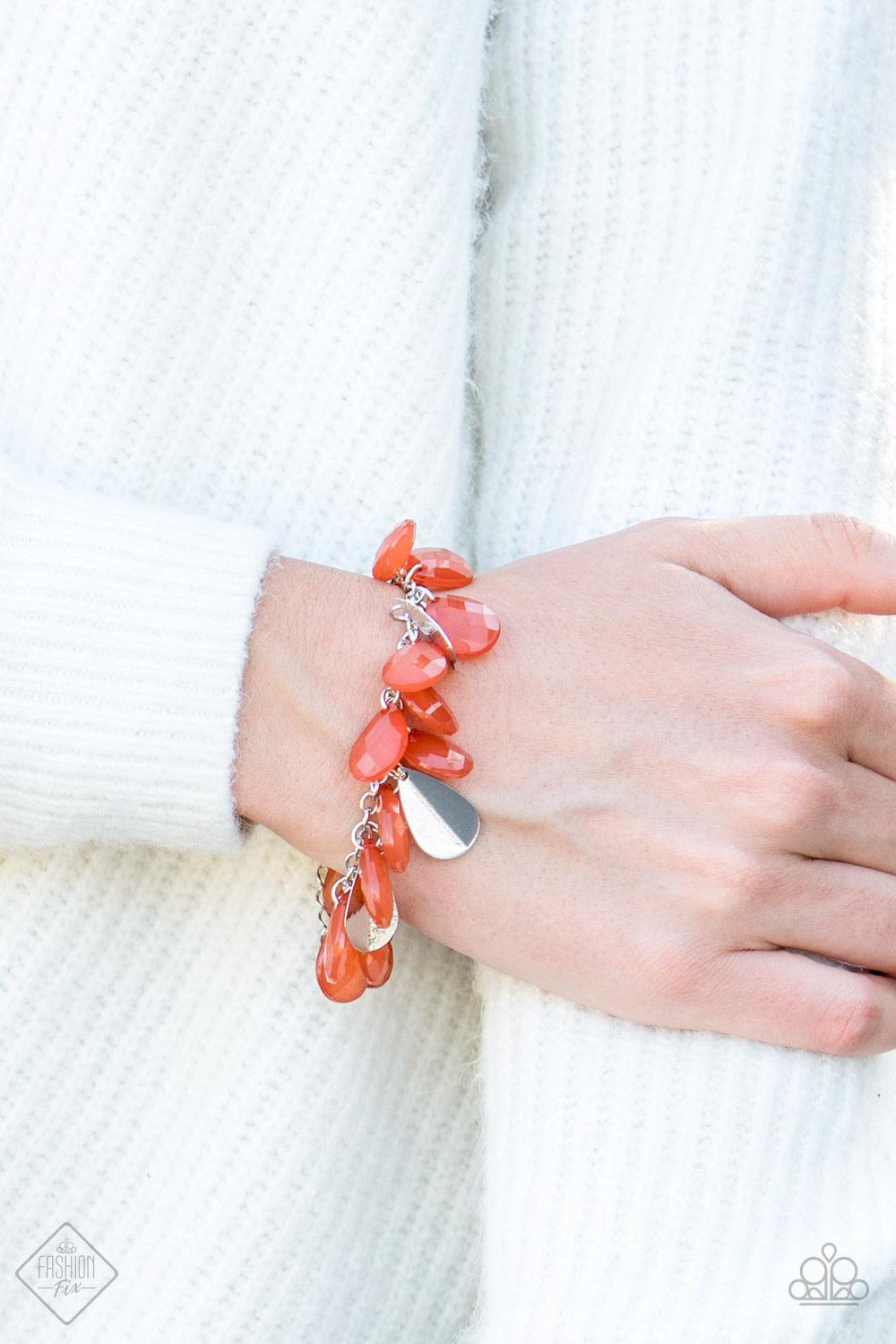 Paparazzi Accessories Fiesta Fiesta - Orange A silver chain is adorned in a flirtatious fringe of faceted burnt orange teardrops. Glittery beveled silver teardrops are sprinkled between the orange beading, adding hints of shimmer to the vivacious design.