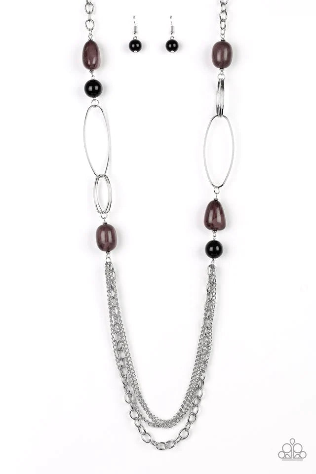 Paparazzi Accessories Pleasante Promenade - Black Featuring polished and cloudy faux rock finishes, black beads link with bold silver hoops. The whimsical compilation gives way to layers of mismatched silver chains for a seasonal finish. Features an adjus