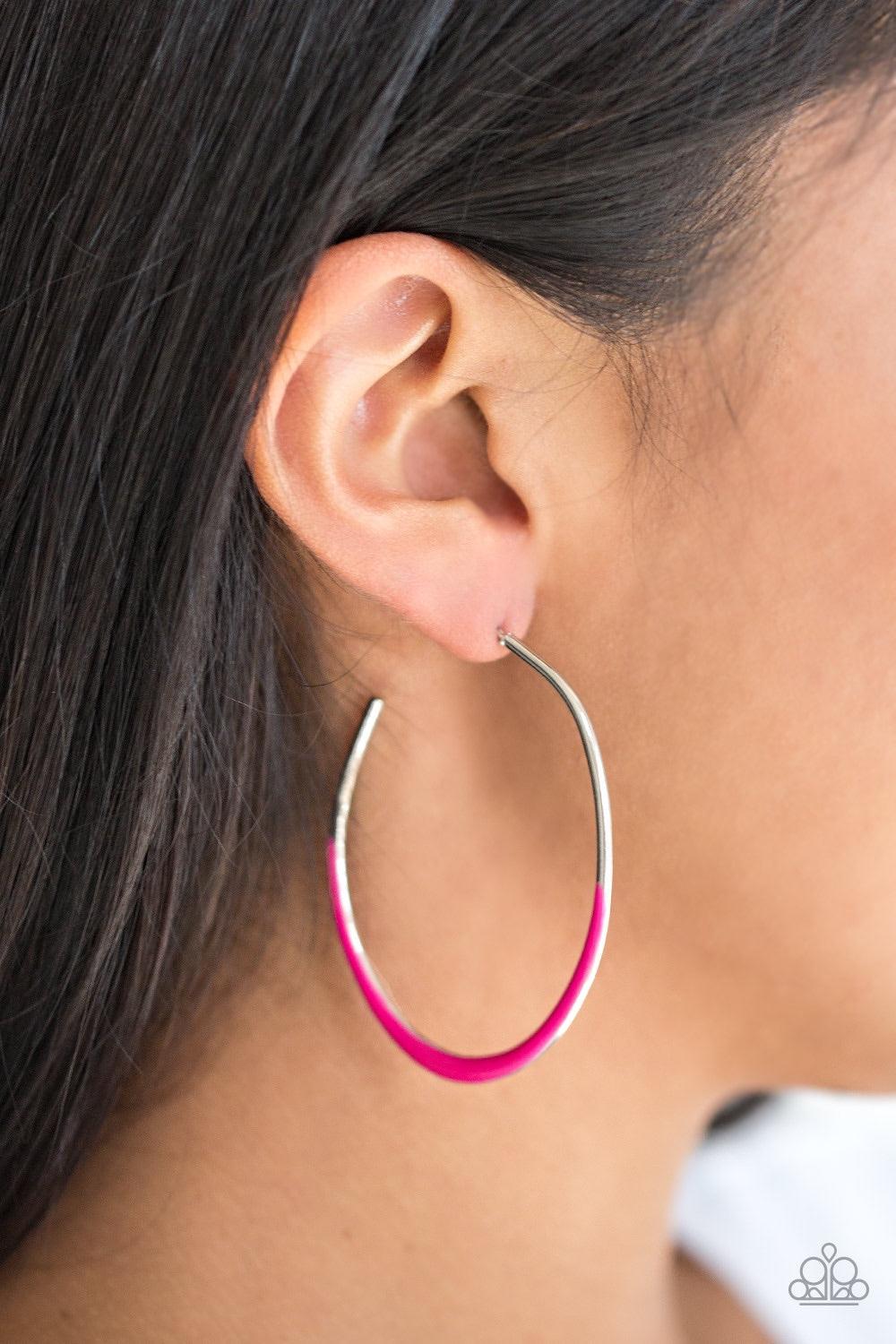Paparazzi Accessories So Seren-DIP-itous - Pink As if dipped in paint, the bottom of an asymmetrical silver hoop has been glazed in a shiny pink finish for a colorful finish. Earring attaches to a standard post fitting. Hoop measures 1 3/4" in diameter. J