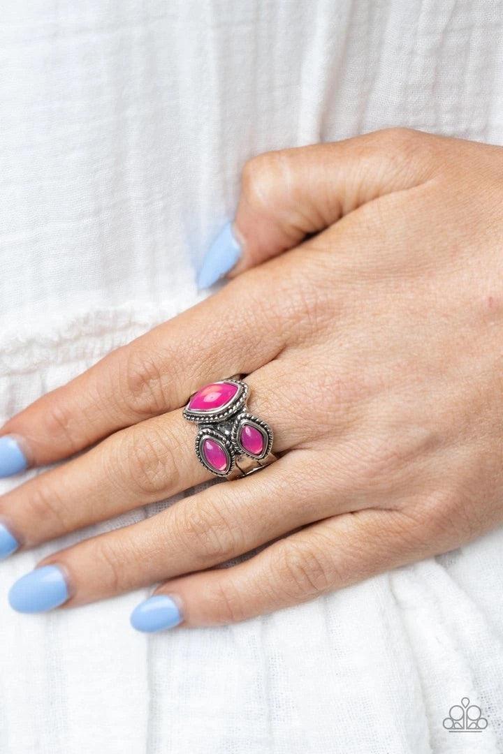 Paparazzi Accessories The Charisma Collector - Pink A trio of glassy pink marquise beads embellish the front of a hammered silver band etched in faux layers, creating an ethereal display atop the finger. Features a stretchy band for a flexible fit. Sold a