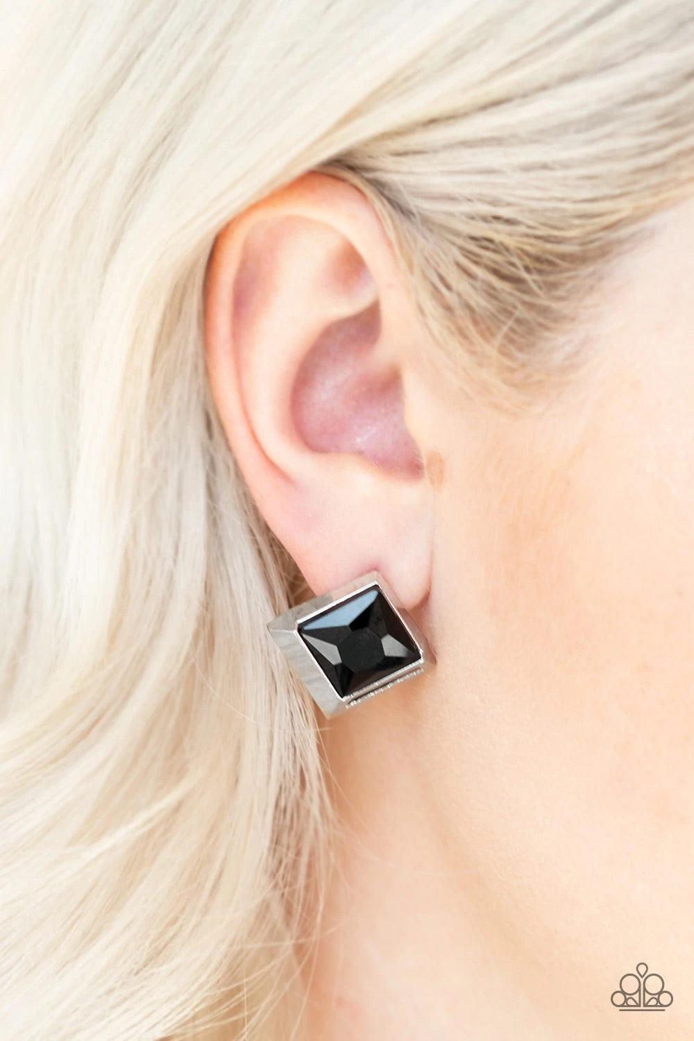 Paparazzi Accessories Stellar Square - Black Featuring a refined square-cut, a faceted black rhinestone is pressed into a 3-dimensional silver frame for an edgy look. Earring attaches to a standard post fitting. Jewelry