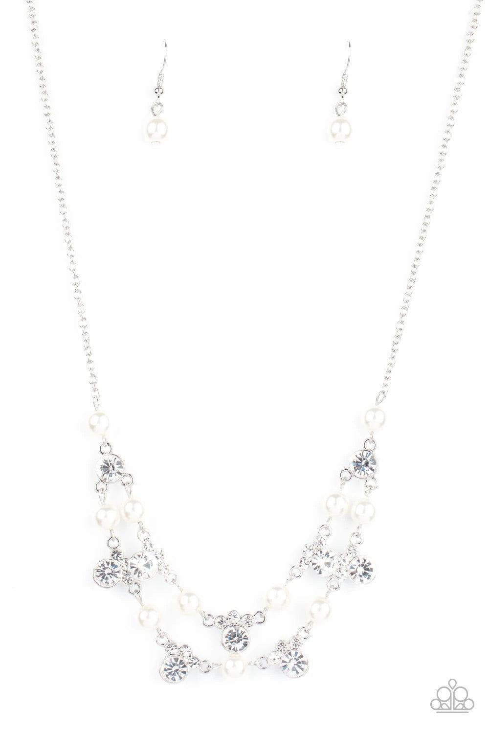 Paparazzi Accessories Royal Announcement - White A bubbly collection of white pearls and glassy white rhinestones delicately connect into two timeless rows below the collar, creating a stunning statement piece. Features an adjustable clasp closure. Jewelr