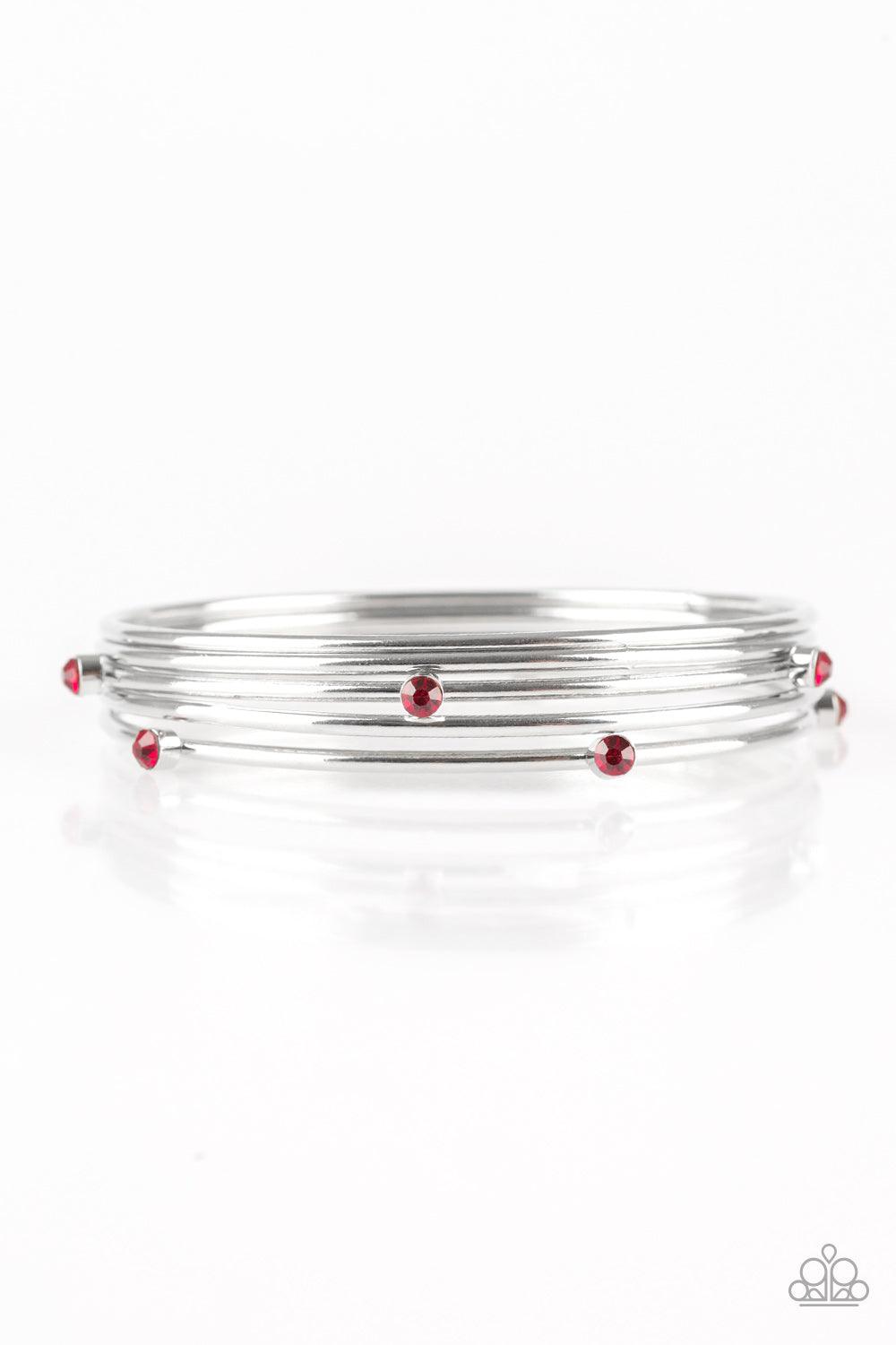 Paparazzi Accessories Delicate Decadence - Red Three shiny silver and two red rhinestone encrusted bangles stack across the wrist for a refined look. Sold as one set of five bracelets. Jewelry