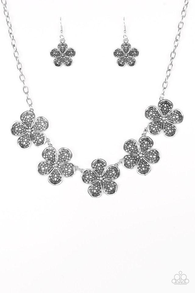 Paparazzi Accessories No Common Daisy - Silver Featuring lace-like petals, glistening silver daisies link below the collar for a seasonal look. Features an adjustable clasp closure. Jewelry