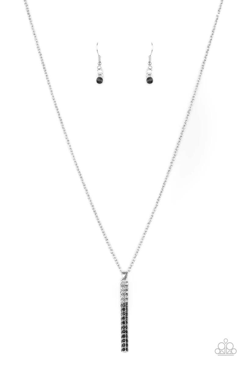 Paparazzi Accessories Tower of Transcendence - Black A sparkly collection of white, smoky, and black rhinestones are encrusted along a silver pendulum that swings along the bottom of a silver chain, creating a glittery ombre effect. Features an adjustable