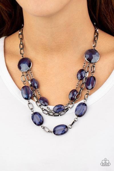 Paparazzi Accessories I Need a GLOW-cation ~Blue Strung between two matching Blue Depths gem-like fittings, two glittery rows of Blue Depths oval gems flank a strand of bold gunmetal chain below the collar for a flawlessly layered look. Features an adjust