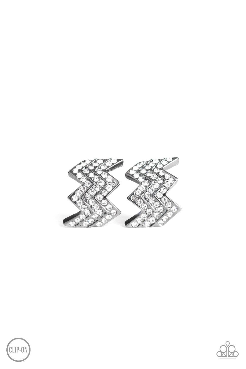 Paparazzi Accessories Fast As Lightning - Black *Clip-On Row after row of glittery white rhinestones are encrusted along a zagging gunmetal frame for an edgy glamour. Earring attaches to a standard clip-on fitting. Jewelry