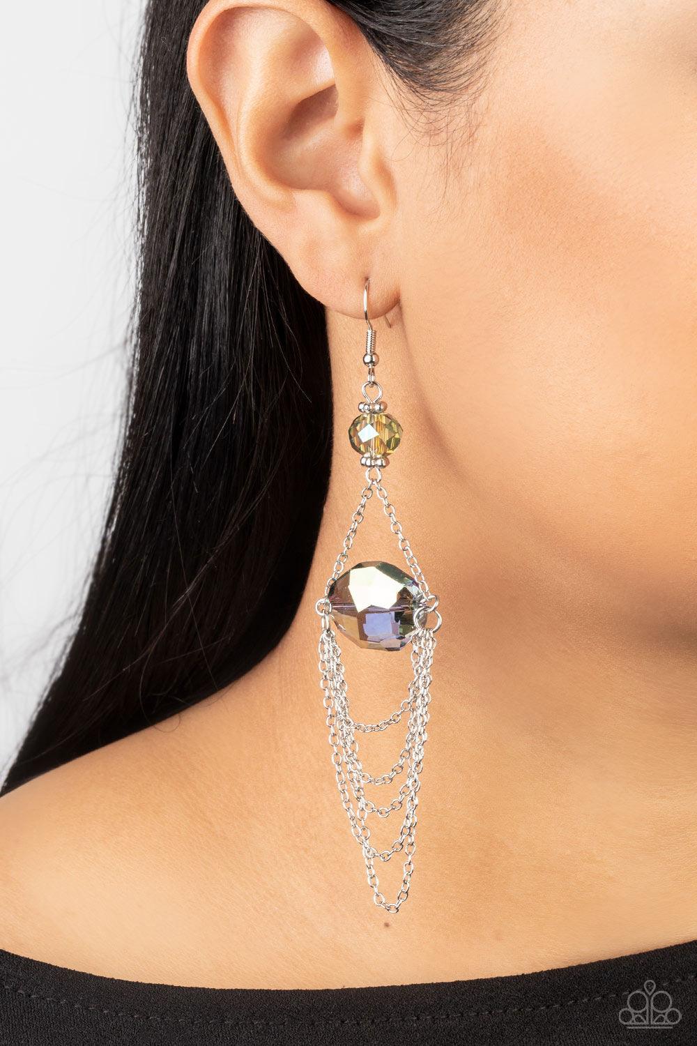 Paparazzi Accessories Ethereally Extravagant - Multi Tiers of dainty silver chains delicately layer from an oversized oval iridescent blue gem that is suspended from a faceted matching multi crystal-like bead, resulting in an ethereal chandelier. Earring