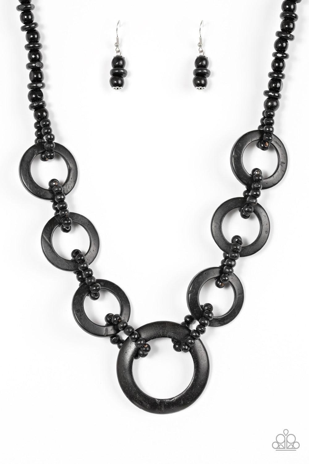 Paparazzi Accessories Endless Summer - Black Mismatched black wooden beads are threaded along a black cord for an earthy look. Brushed in a distressed finish, black discs connect with beaded links across the chest for a summery finish. Jewelry