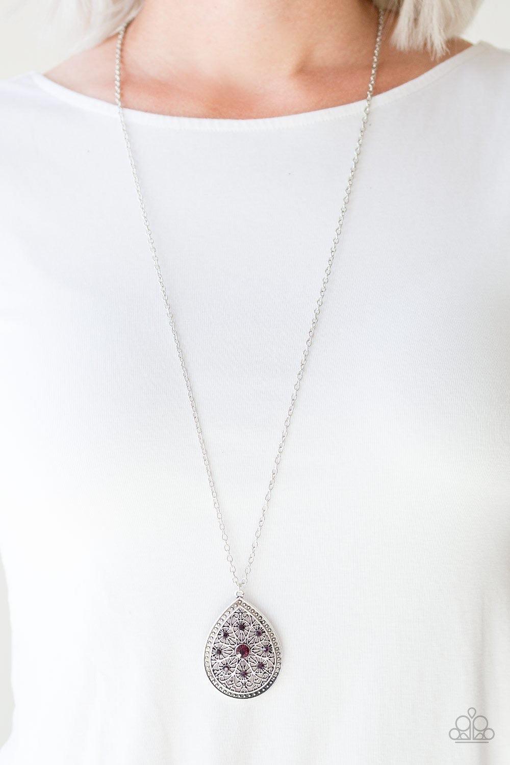 Paparazzi Accessories I Am Queen - Purple A dramatic teardrop pendant swings from the bottom of an elongated silver chain, elegantly slimming the torso. Glittery purple rhinestones are sprinkled along the pendant as silver filigree dances across the cente